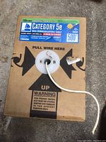 Box 1 of Category 5e Data Communications Cable with clear labeling showing specifications, ivory color, 500 ft length