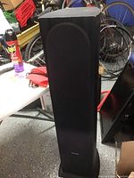 Full view of the black Pioneer floor standing speaker showing its tall rectangular shape and fabric grille.