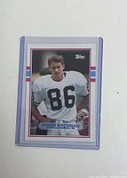 1989 Topps Brian Brennan card in plastic sleeve, showing player in white jersey numbered 86.