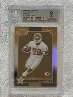 Front of graded 2000 Leaf Certified Mirror Gold Dante Hall football card featuring player in action.