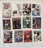 Front side of 12 football trading cards showing players John Elway, Bo Jackson, Mike Ditka, Demaryius Thomas, Peyton Manning among others, some holographic and action shots.