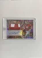 Front of Jake Fromm 2020 Panini patch autograph football card with patch and signature in plastic case.