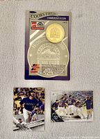 Front view of Coors Field commemorative coin package with two Colorado Rockies baseball cards.
