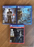 Front covers of Uncharted 4, Styx: Shards of Darkness, and The Last of Us Remastered PS4 games.