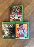 Front covers of South Park: The Stick of Truth, Fallout 4, and Madden NFL 20 Xbox One games