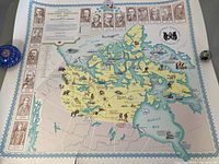 Overview of one vintage map showing the Northwest Territories with detailed illustrations of animals, landmarks, and historical portraits bordering the map.