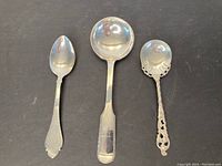 Three spoons on black background