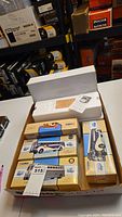 Box containing five boxed Corgi diecast bus models with various liveries.