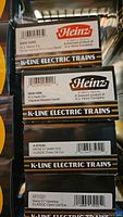 Close-up of four boxed K-Line Electric Trains freight cars with Heinz branding and product names visible on box sides.