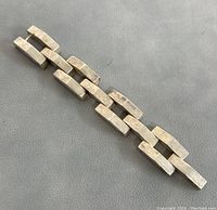 Horizontal view of the full bracelet to show its length and rectangular linked design.