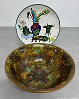 Photo of the cloisonné enameled bowl showing floral designs and brownish interior.