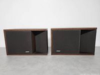 Front view of pair of vintage Bose 201 Series II speakers with fabric grilles and Bose logos.