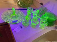Full lot on countertop under UV showing fluorescence