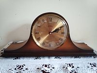 Front view of the wooden mantel clock showing the clock face with Roman numerals and the BIRKS branding.