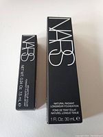 Box of NARS Natural Radiant Longwear Foundation, black with white NARS lettering, 30 ml.