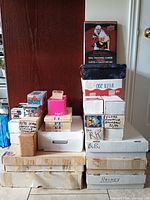 Overall view of stacked themed and plain cardboard boxes of trading cards