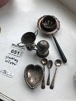 Overview of all silver pieces on windowsill