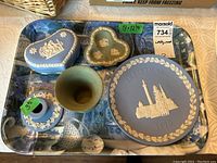 Photo showing the full lot including Wedgwood jasperware Christmas plate, two heart-shaped trinket boxes, candleholder, vase, dish, all arranged on a blue and white plastic tray with measurements sticker visible.