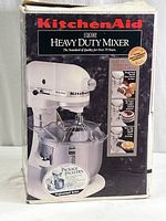 Front view of the KitchenAid Heavy Duty Mixer box showing the product branding and main image of the mixer.