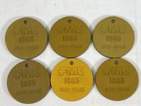 Set of six vintage metal tokens with FMC logo and 1983 text on one side, Open House event tokens.
