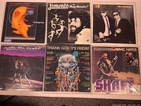 Six vinyl albums arranged together showing front covers with titles and artwork for each album.