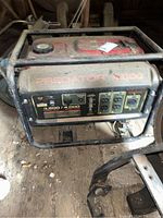 Front view of Predator 4000 generator showing control panel and branding on top with dust accumulation.