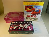 LEGO Star Wars Build Your Own Adventure Galactic Missions box on left, LEGO Mindstorms 40413 box on right, pink holographic Shopkins box in front