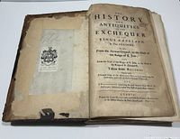 Open to title page showing frontispiece text and bookplate pasted to front board