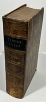 Brown leather hardcover book, spine reads 'Byron's Works' with decorative gilt stamping.