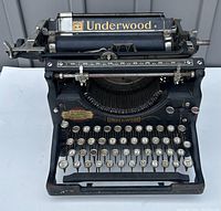 Front view of black Underwood Standard typewriter showing brand name and key layout