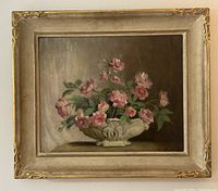 Full front view of framed oil painting showing floral still life and frame design