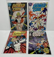 Four DC Power Girl comic books displayed upright, bagged and boarded, showing front cover artwork for issues #1 to #4.
