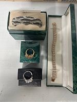 Photo showing all jewelry items in their boxes including bracelets and rings