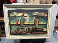 Front view of framed seascape print showing sailboats and figures under moonlight