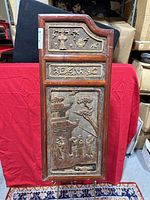Full front view of the rectangular hand carved wooden Chinese door panel showing the entire design and structure.