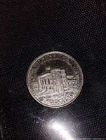 Coin front side showing City of London Canada building and denomination.