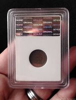 Front view of the 1908 Indian Head Penny in a certified plastic slab showing authenticity hologram and original markings.