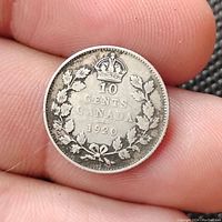 Reverse view of 1920 Canadian silver 10 cents coin showing denomination, crown and wreath.