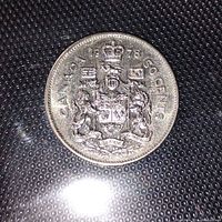 Reverse side showing Canadian Coat of Arms, date 1978 and 50 cents denomination