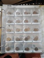 First photo showing one page from the collection with 20 nickels in clear plastic holders, visible date range from 1960s and up to recent years.