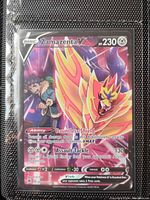 Front view of Zamazenta V holographic full art Pokémon card showing details of the card text and art.