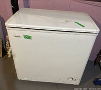 Front and side views of white Danby chest freezer showing overall condition and size.