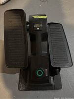 Front view of Cubii stepper with dual foot pedals and digital display