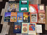 Image of assorted First Nations-related books arranged on the floor including Carlos Castaneda titles and other spiritual and cultural works.