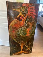 Full view of the rectangular wood panel painting depicting colorful rooster in profile with open beak.