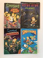 Front covers of all four Simpsons comics showing colorful artwork and titles