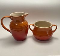 Side view showing both the creamer pitcher and the open sugar bowl, illustrating the color gradient and shape.