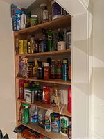 Full view of shelving with assorted cleaning products and sprays