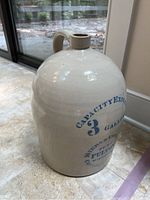 Front view showing off-white glazed jug and cobalt blue capacity text