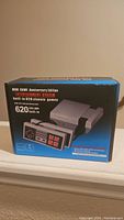 Mini classic entertainment system box showing 620 built-in games and console image